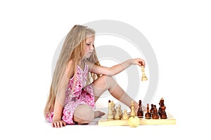 Cute girl playing chess