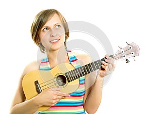 Cute girl playing an ukulele