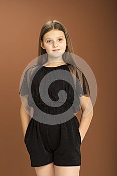 Cute girl posing in black jumpsuit