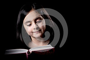 Cute girl posing while reading