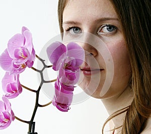 Cute girl with a purple orchid