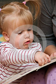 Cute girl reading book