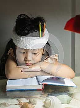 Cute girl reading a book