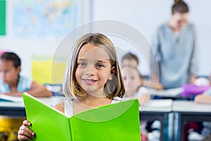 Cute girl reading book