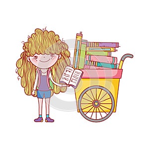 Cute girl reading book and cart with many books