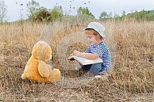 Cute girl reading book Teddy bear