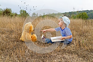 Cute girl reading book Teddy bear