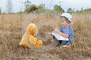 Cute girl reading book Teddy bear