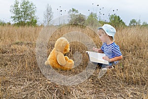 Cute girl reading book Teddy bear