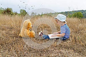 Cute girl reading book Teddy bear