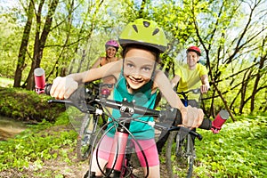 Cute girl riding her mountain bike in the park