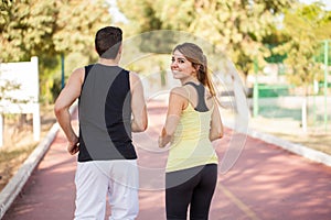 Cute girl running with her boyfriend