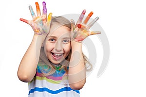 Cute girl showing hands painted in bright colors isolated on white