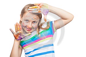 Cute girl showing hands painted in bright colors isolated on white