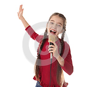Cute girl singing in microphone on white