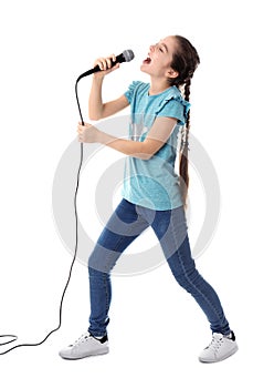 Cute girl singing in microphone on white