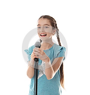 Cute girl singing in microphone on white