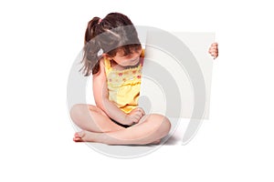 Cute girl sitting with whiteboard