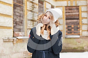 Cute girl smiling near an old brick wall. Outdoor portrait.. photo