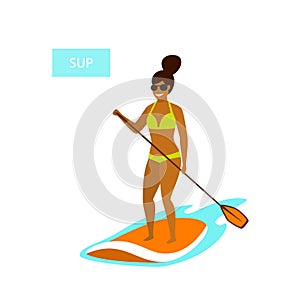 Cute girl stand up paddling in the sea