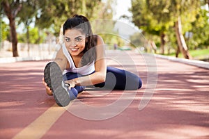 Cute girl stretching outdoors