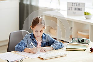 Cute Girl Studying at Home