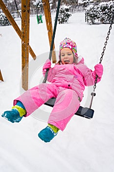 Cute girl in swing