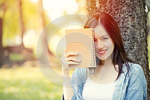 Cute girl teen writer happy smile with diary note book