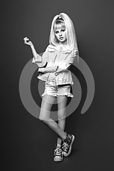 Cute girl teenage with long blond hair posing studio nature portrait. Black and white