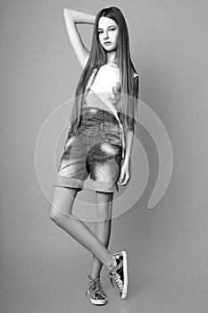 Cute girl teenage with long hair posing studio nature portrait. Black and white