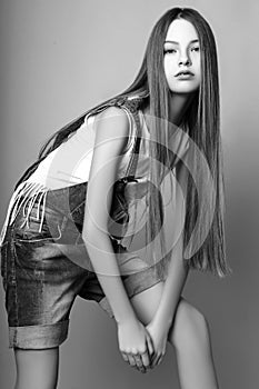 Cute girl teenage with long hair posing studio nature portrait. Black and white