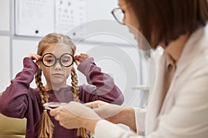 Cute Girl Trying On New Glasses