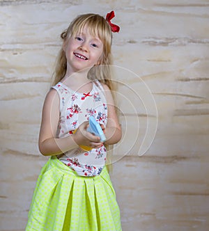 Cute girl using spray bottle