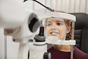 Cute Girl Using Vision Test Machine