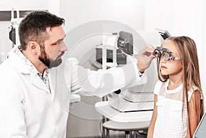 Cute girl visiting ophthalmologist