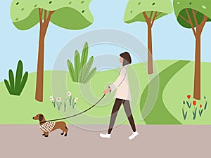 Cute girl walking with dog dachshund in overalls in spring city park or forest. Fall soothing outdoors landscape: trees, leaves,