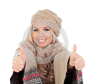 Cute girl with warm winter clothing saying Ok