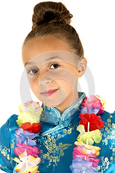 Cute girl wearing a Chinese dress and a lei smiling