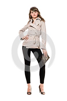Cute girl wearing a coat and black leggings