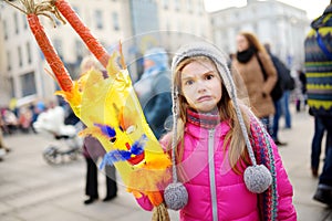 Cute girl wearing frightening masks during the celebration of Uzgavenes, a Lithuanian annual folk festival taking place seven week