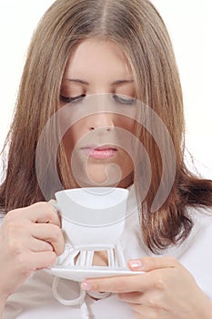 Cute girl with white mug and plate