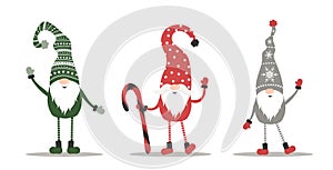 Cute gnomes in red santa hats on white background. Scandinavian christmas elves.