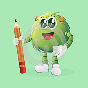 Cute green monster holding pencil