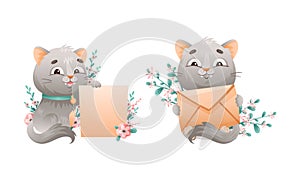 Cute grey kitten holding blank paper banner and postal envelope set. Lovey playing cat animal cartoon vector