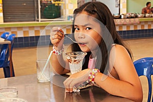 Cute gril dripping ice cream photo