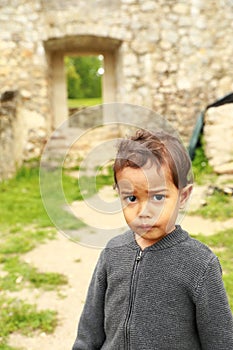 Cute grinning boy on old town Dreznik