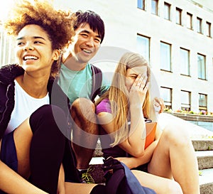 Cute group teenages at the building of university