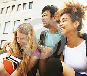 cute group teenages at the building of university