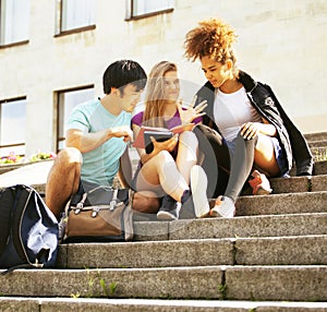 cute group teenages at the building of university