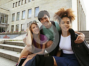 Cute group teenages at the building of university